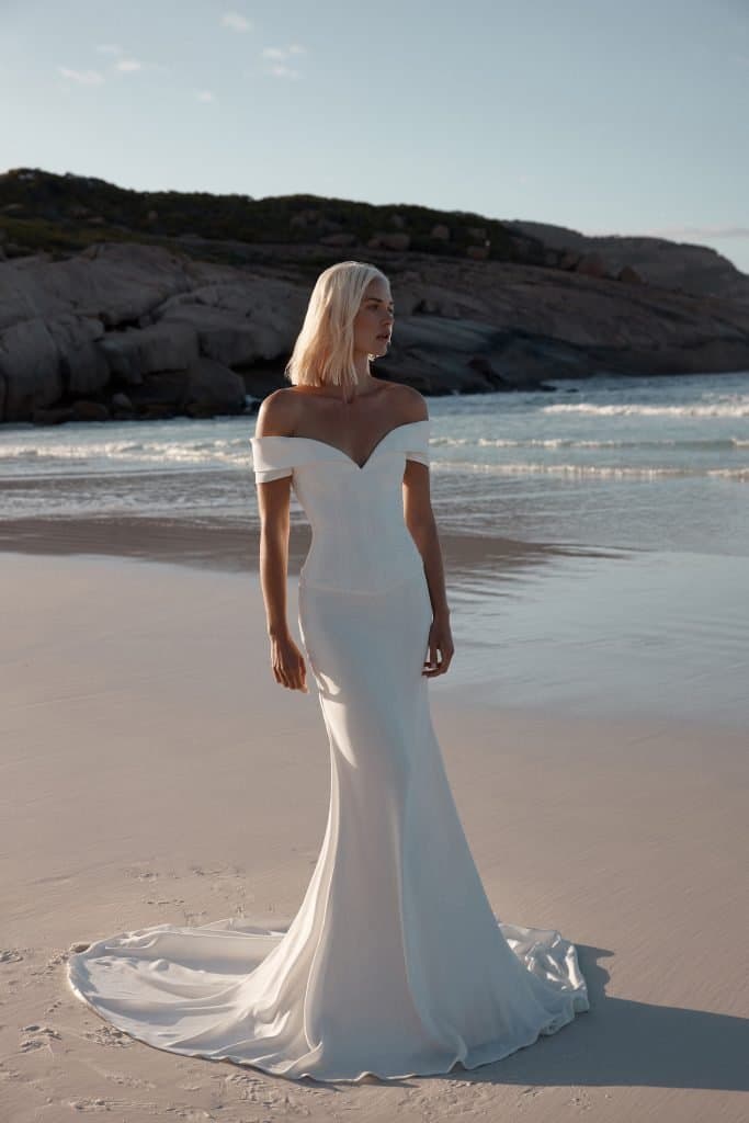 Model wearing white wedding dress